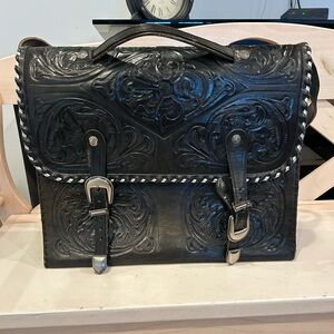 Black leather briefcase with silver hardware